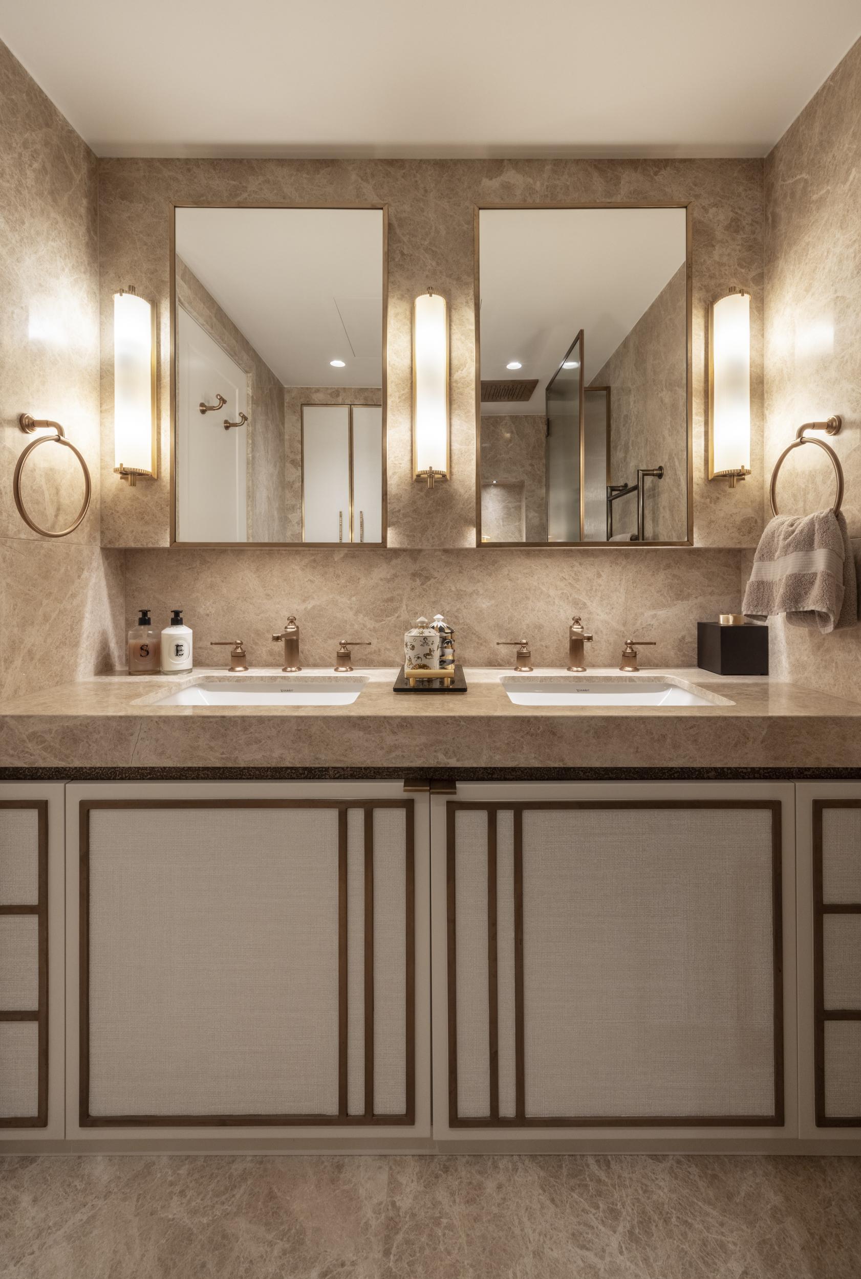 Bespoke bathroom vanity furniture with framed doors and brass detailing
