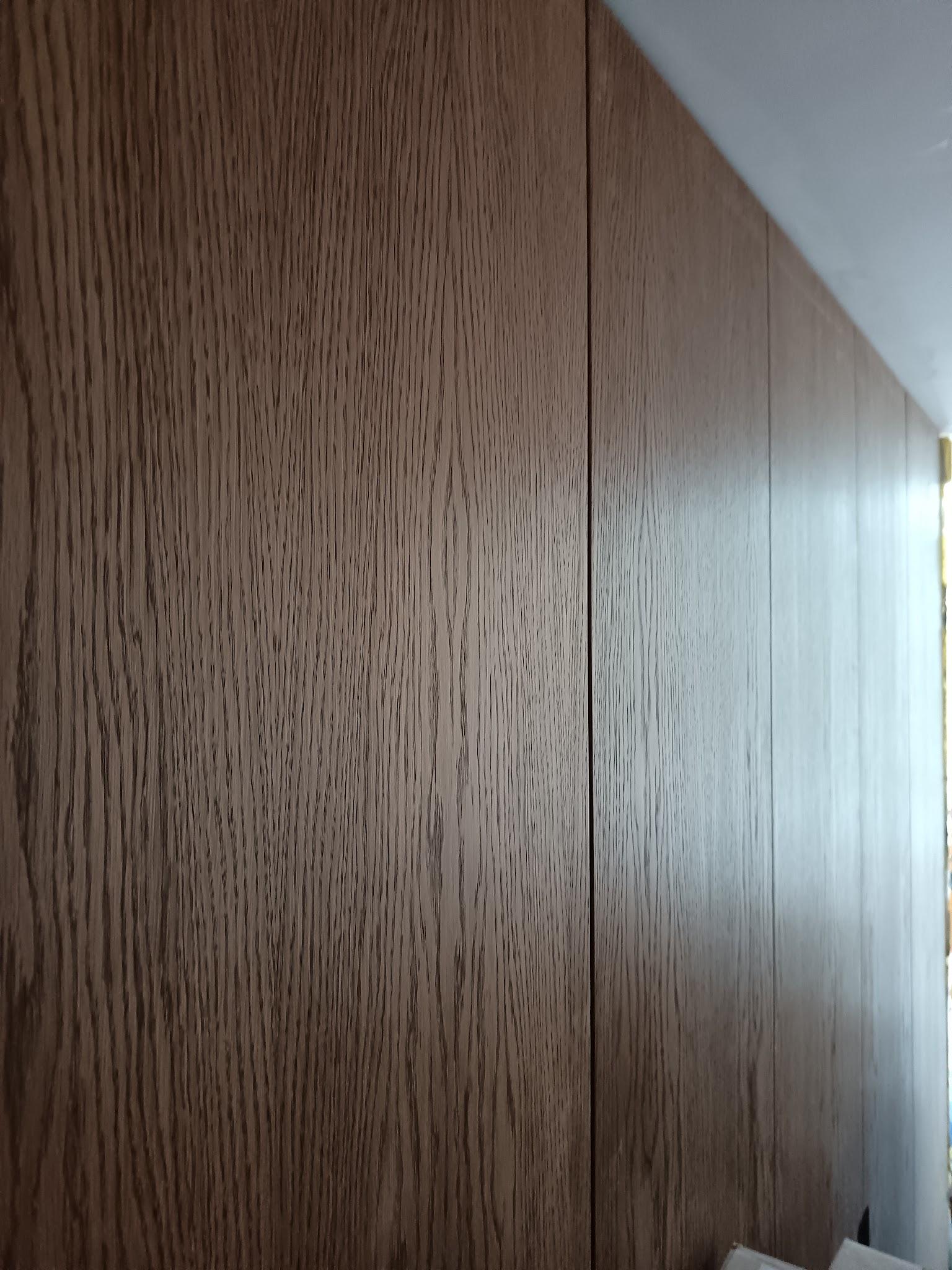 Dark timber veneer panelling detail on bespoke London joinery